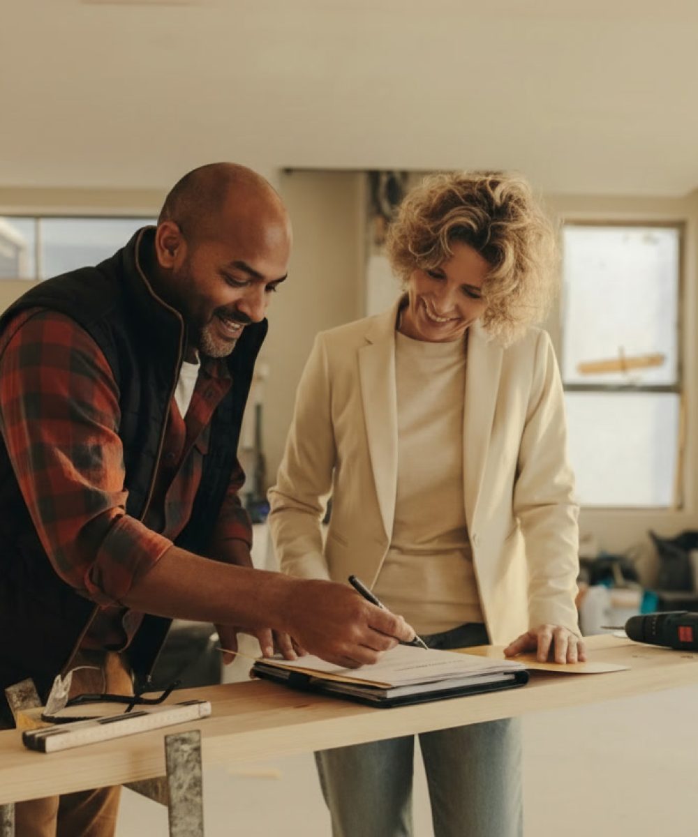 Saltire Construction team collaborating with architect and interior designer on luxury home renovation project plans